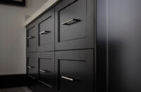 A Black & White master bathroom design with a black painted bathroom vanity.