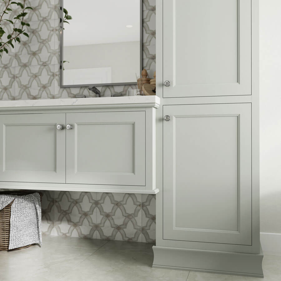 A stunning and elegant bathroom vanity with off-white/gray painted cabinets in a chic inset door style, called Meridien, by Dura Supreme Cabinetry.